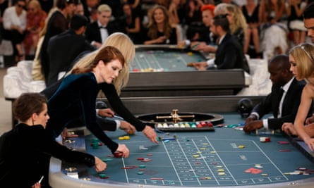 Actors Kristen Stewart and Julianne Moore join the high rollers at a 2015 show