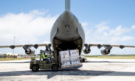 Australian Defence Force members unload humanitarian supplies from an aircraft at Fuaʻamotu airport in Tonga