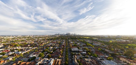 Aerial of suburban Melbourne and CBD at sunset