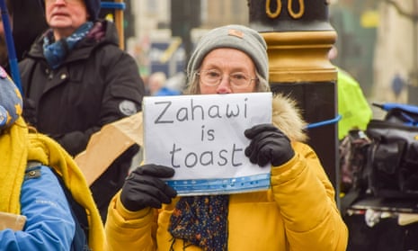 A protester in Westminster, London, on Wednesday holds up a sign that reads: 'Zahawi is toast'