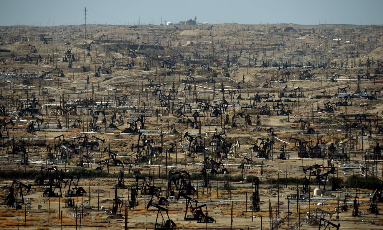 Oil pumping jacks and drilling pads close to Bakersfield, California.