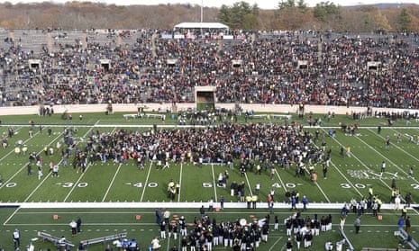 Students stage a fossil fuel protest delaying the start of the second half of the Harvard-Yale game in New Haven, Connecticut, on 23 November. 