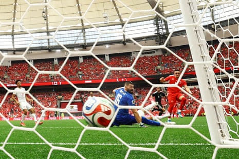 Switzerland's Ruben Vargas scores their first goal past Canada's Maxime Crepeau.