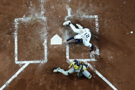 Rays outfielder Jonny DeLuca scores a run in the second inning against the Brewers during Game 4 of the World Series on Tuesday night at Tropicana Field.
