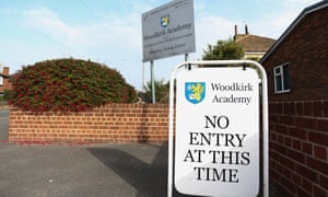 A sign at a school which says 'no entry'