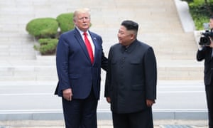 US President Donald J. Trump talks with North Korean leader Kim Jong-un after crossing the Military Demarcation Line into the North’s side 