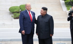 US President Donald J. Trump talks with North Korean leader Kim Jong-un after crossing the Military Demarcation Line into the North’s side
