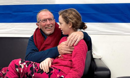 Emily Hand embracing her father at a hospital in Israel after being released