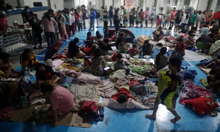 Thousands of villagers took shelter in schools and gymnasiums, like this one in Manila, as Typhoon Noru slashed Luzon island.