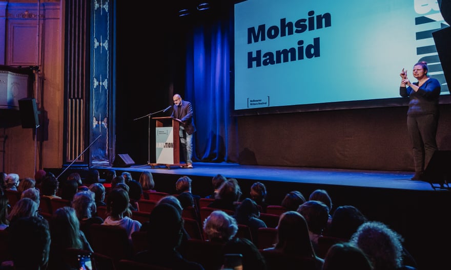 Mohsin Hamid addresses a seated audience from the stage at the Melbourne Writers Festival