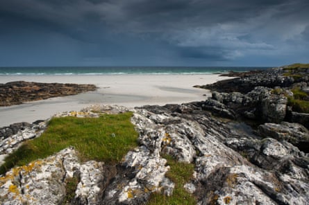 rocks and beach as storm comes in