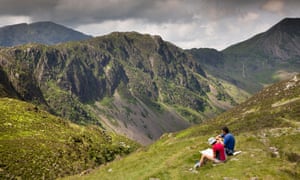 Walkers check a map by Hay Stacks, Cumbria.