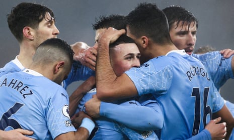 Phil Foden is mobbed after scoring what turned out to be the winning goal.