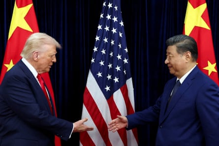 Trump and Xi about to hake hands with Chinese and US flags behind