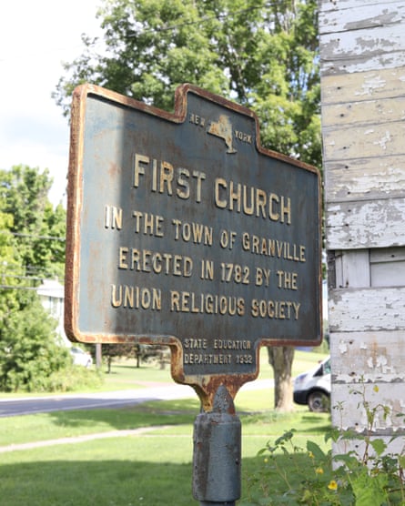 A sign outside the church bought by Nick Porter and Christiana Peña.