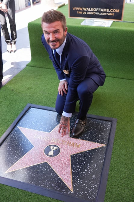 David Beckham poses with his star on the Hollywood Walk of Fame in Los Angeles in June.