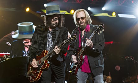 Mike Campbell and Tom Petty performing in 2017