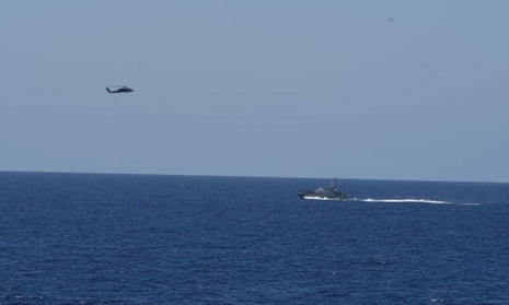 A helicopter and a boat at sea