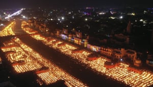 Ayodhya, India. People light lamps on the banks of the river Saryu. More than 900,000 earthen lamps were lit and kept burning for 45 minutes as the north Indian city retained its Guinness World Record for lighting oil lamps as part of the Diwali celebration