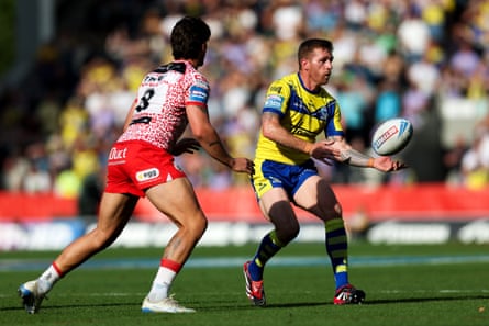 Marc Sneyd throws a pass while under pressure from Owen Trout of Leigh.