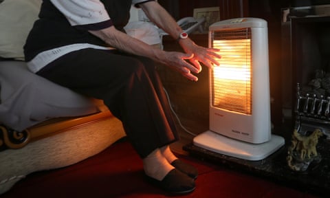 A person with an electric heater