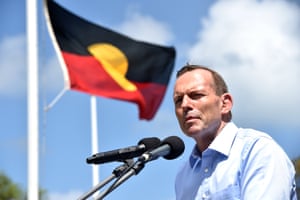 Tony Abbott with an Aboriginal flag