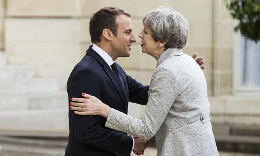 Emmanuel Macron greets Theresa May