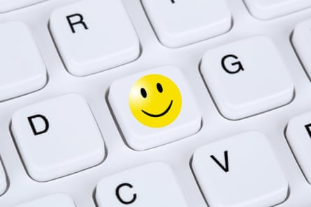 Happy smiley symbol on a keyboard to represent how the internet might actually improve our wellbeing