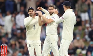 Chris Woakes of England (centre) celebrates his wicket of Travis Head of Australia.