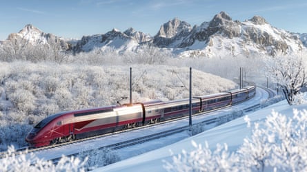 A red and silver train in a snow-covered mountainous landscape