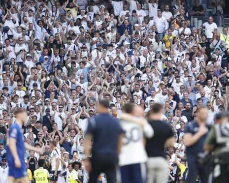 Tottenham supporters celebrate after the 1-0 win over Everton secured their top-flight status.