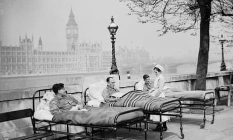 Tuberculosis patients from St. Thomas’ Hospital rest in their beds in the open air by the River Thames, opposite the Houses of Parliament, May 1936.