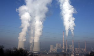 Steam rising from the cooling towers of a coal fired power plant