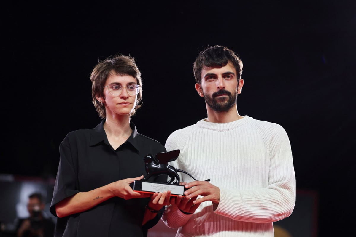 NAZA directors Yuval Abraham and Rachel Szor hold their Special Jury Award at the 83rd Venice International Film Festival