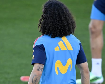 A photo from behind of the Spain defender Marc Cucurella during team training, which shows on the back of his left arm a tattoo of the teamâÂÂs head coach, Luis de la Fuente