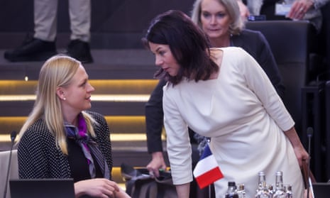 Finnish Foreign Minister Elina Valtonen (L) and German Foreign Minister Annalena Baerbock converse during a North Atlantic Treaty Organization (NATO) Foreign Affairs Ministers meeting in Brussels.