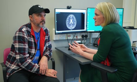 Dr Heather Shaw speaks to Steve Young, with an MRI of his brain on the camouflage, all thru a consultation at University College Clinic Macmillan Most cancers Centre in London