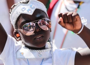 A young reveller takes part in the children’s parade