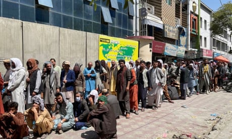 Afghans in long queues outside a bank in Kabul