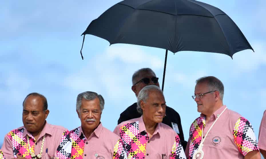 The leaders of Kiribati, Cook Islands, Tonga and Australia wait to pose for the family photo before the leaders retreat at the Pacific Islands Forum that caused divisions between Australia and other Pacific leaders.