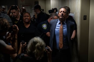police handcuff a man and a woman