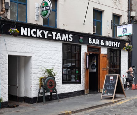 Whitewashed stone exterior of Nicky-Tams Bar & Brothy