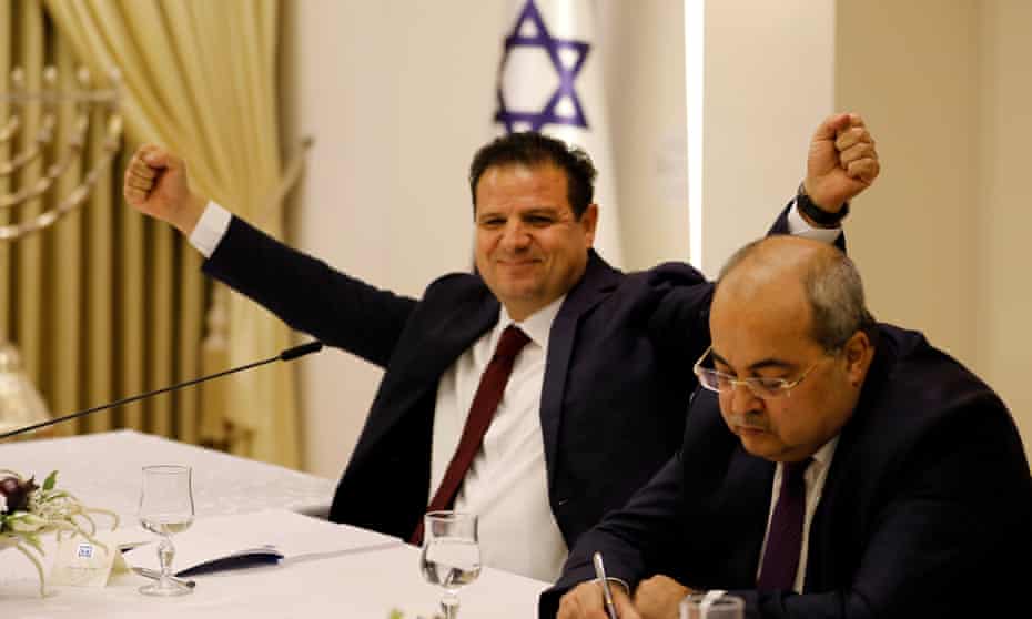 Joint List leader Ayman Odeh, left, after announcing the alliance’s decision. 