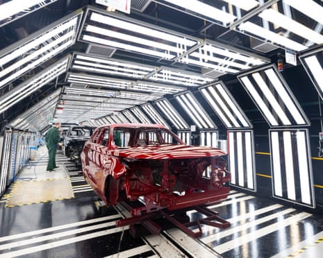 Range Rover SUVs in a light tunnel at the Jaguar Land Rover vehicle manufacturing plant in Solihull, UK