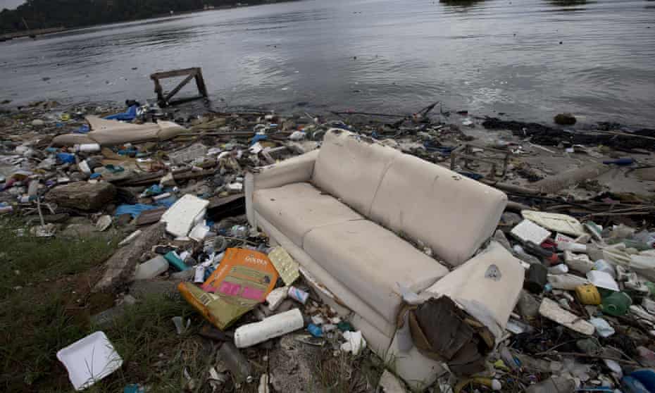 Sofa and rubbish on shores of Guanabara Bay