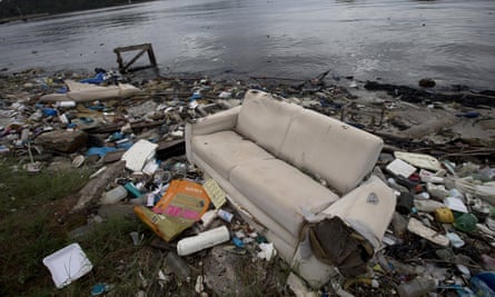 A discarded sofa litters the shore of Guanabara Bay in Rio de Janeiro, Brazil