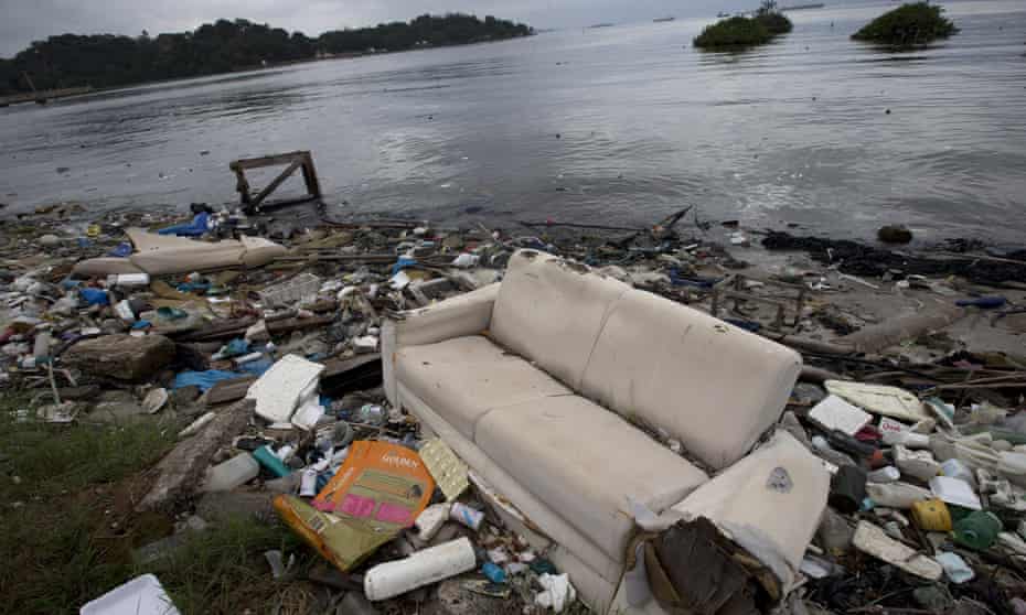 A discarded sofa is among the rubbish on the shore of the polluted Guanabara Bay in Rio de Janeiro, a venue for the 2016 Olympics