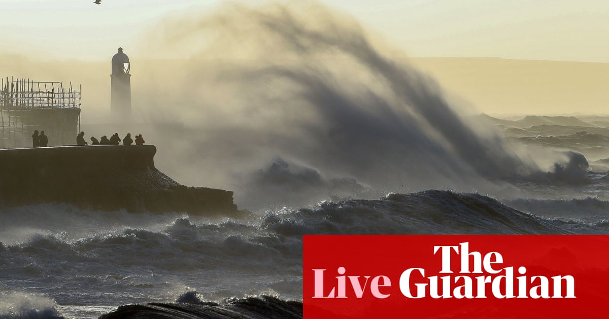 Storm Eunice: at least two die in England after woman struck by tree and man’s car hit by debris – latest