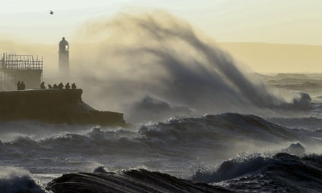 Waves crash against the sea wall at Porthcawl, south Wales