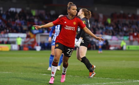 Nikita Parris celebrates scoring for Manchester United.